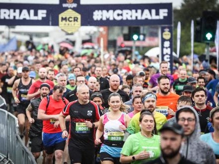 Runners crossing the start line of the Manchester Half Runners crossing the start line of the Manchester Half