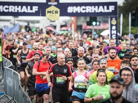 Runners crossing the start line of the Manchester Half Runners crossing the start line of the Manchester Half