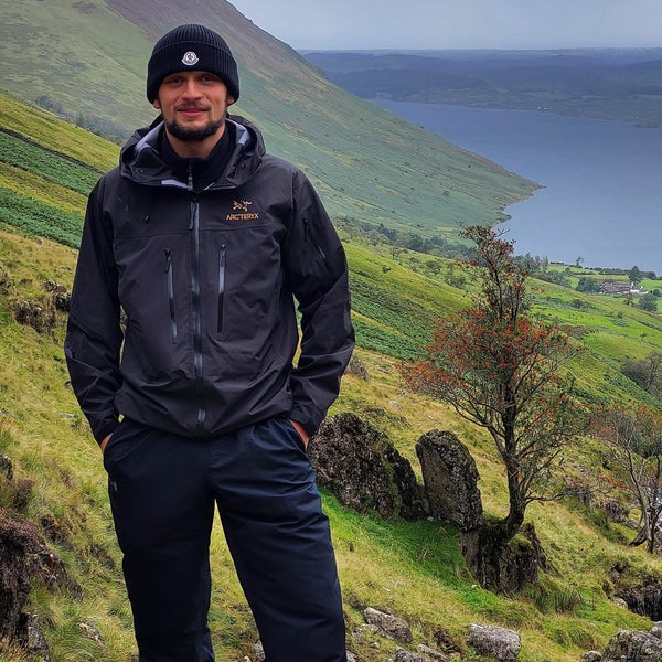 Man hiking on a mountain by the sea Man hiking on a mountain by the sea