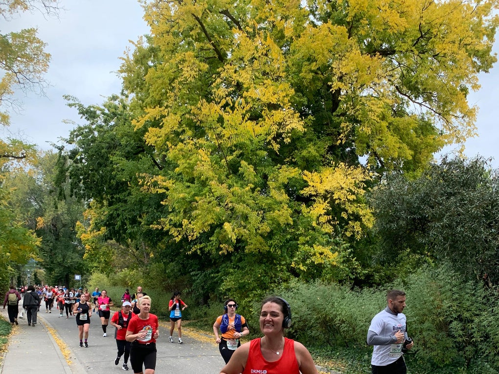 Woman running in a DKMS vest Woman running in a DKMS vest
