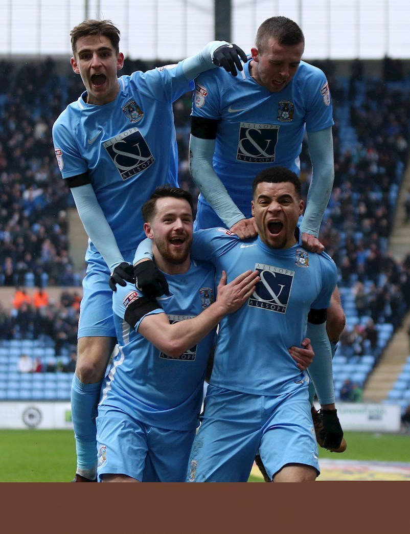 Jubilent Coventry City players celebrate goal Against Swindon Town