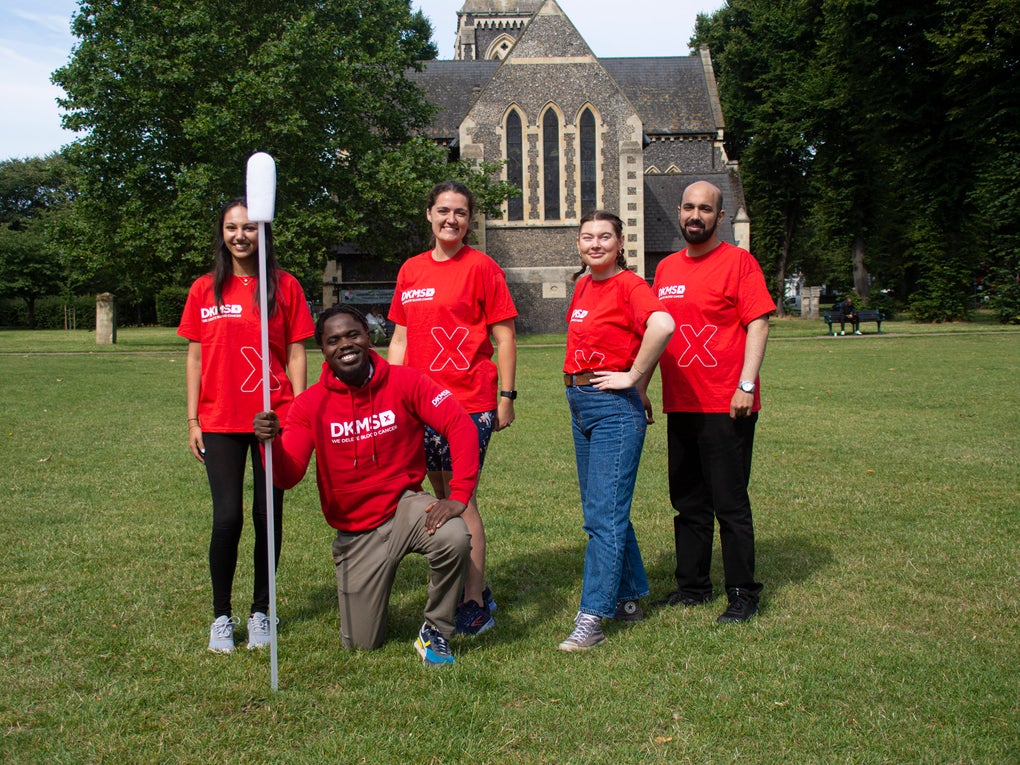 Five DKMS staff with a giant swab Five DKMS staff with a giant swab