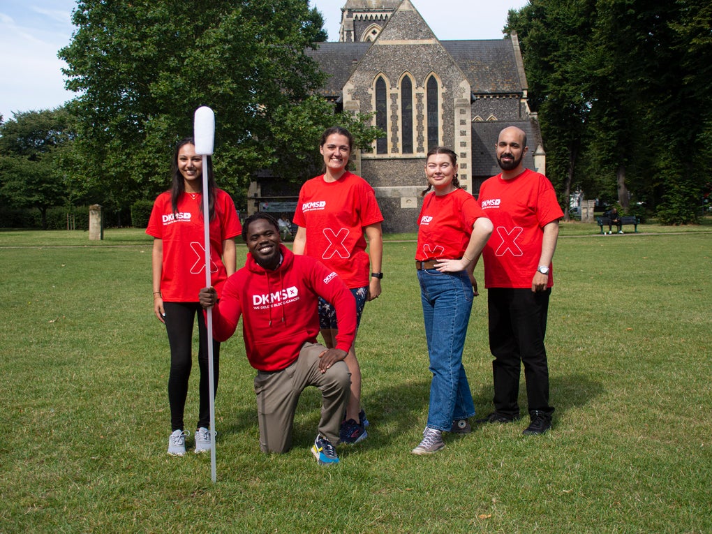 Five DKMS staff with a giant swab Five DKMS staff with a giant swab