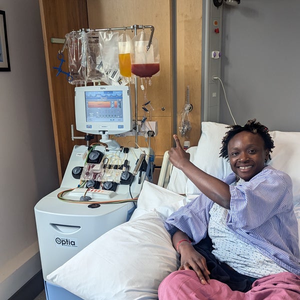 African woman smiling in a hospital bed African woman smiling in a hospital bed