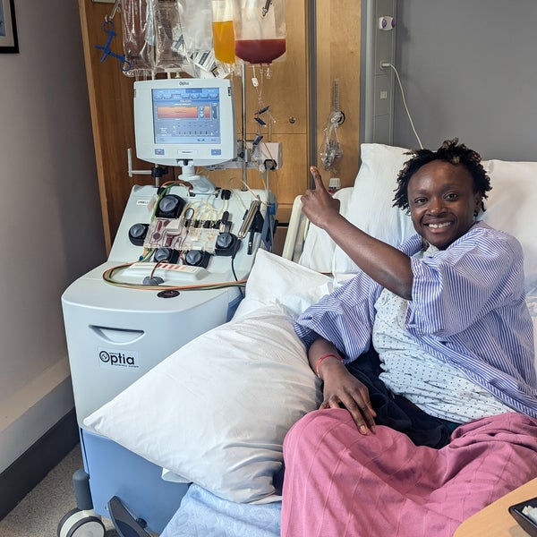 African woman smiling in a hospital bed African woman smiling in a hospital bed