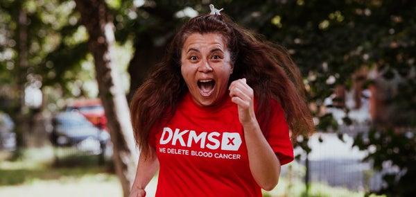 Woman running in DKMS top