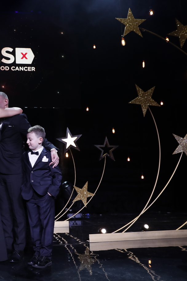 Leah McDougall and James O'Donnell hug at DKMS Gala in London