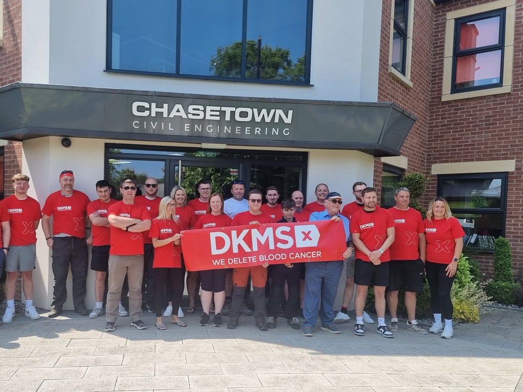 Chasetown Civil Engineering staff outside ther offices wearing DKMS T-shirts and holding a DKMS banner Chasetown Civil Engineering staff outside ther offices wearing DKMS T-shirts and holding a DKMS banner