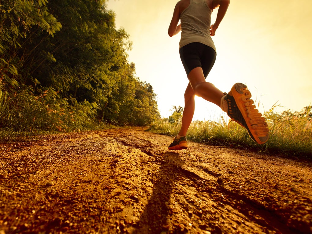 Solo runner running along country path Solo runner running along country path