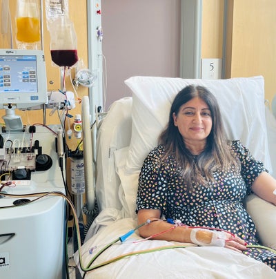 Woman smiling at the hospital donating stem cells Woman smiling at the hospital donating stem cells