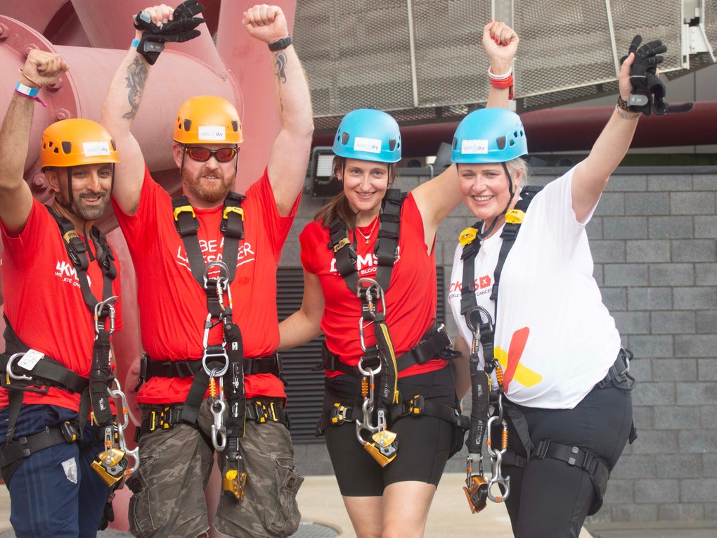 Gilly with Jamie and Fran (DKMS Scotland) and Sam (DKMS West London) in harnesses and helmets preparing to abseil Gilly with Jamie and Fran (DKMS Scotland) and Sam (DKMS West London) in harnesses and helmets preparing to abseil