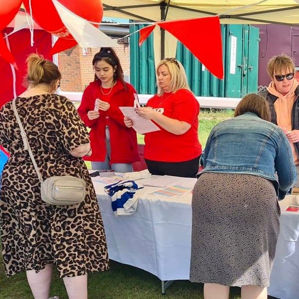 People swabbing at a DKMS registration event People swabbing at a DKMS registration event