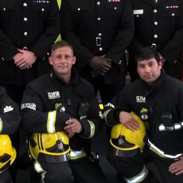 Paul Smith sitting with team mates in their uniform Paul Smith sitting with team mates in their uniform