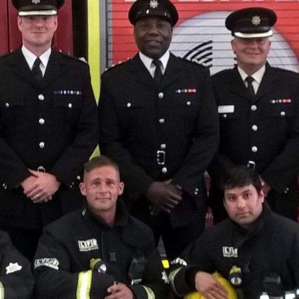 Paul Smith sitting with team mates in their uniform Paul Smith sitting with team mates in their uniform