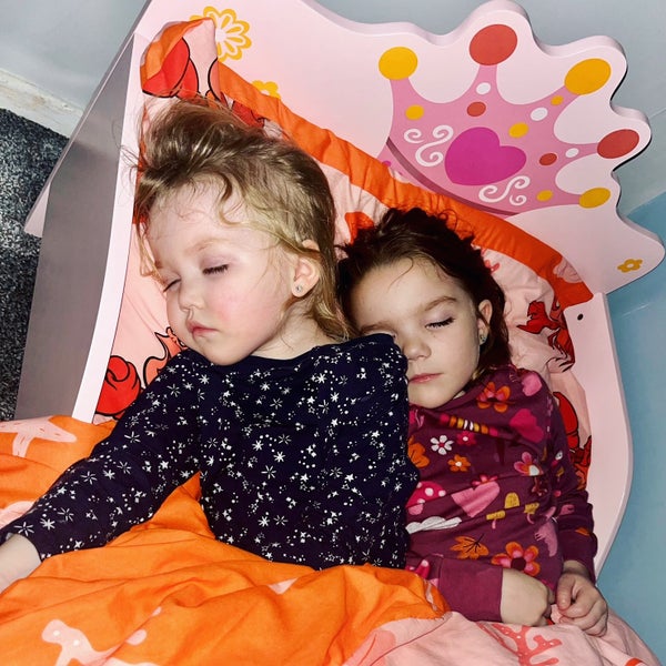 Josie and her sister Adeline, peacefully sleeping together 