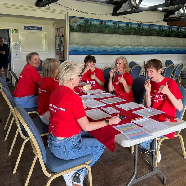 People swabbing at a stem cell registration event People swabbing at a stem cell registration event