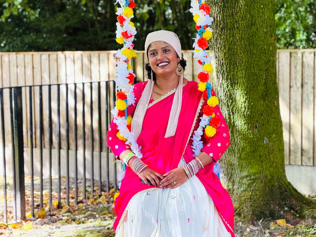 Rafiya wearing a pink and white dress sitting on a swing Rafiya wearing a pink and white dress sitting on a swing
