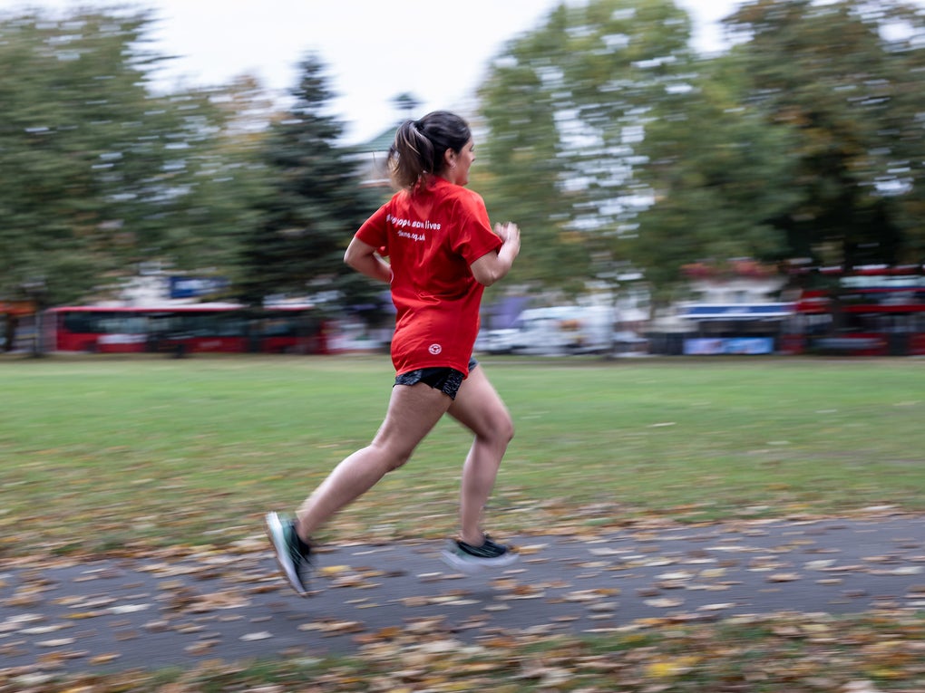 Woman running in red top Woman running in red top