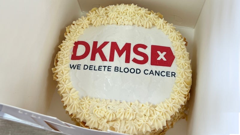 Celebration cake with DKMS logo on top