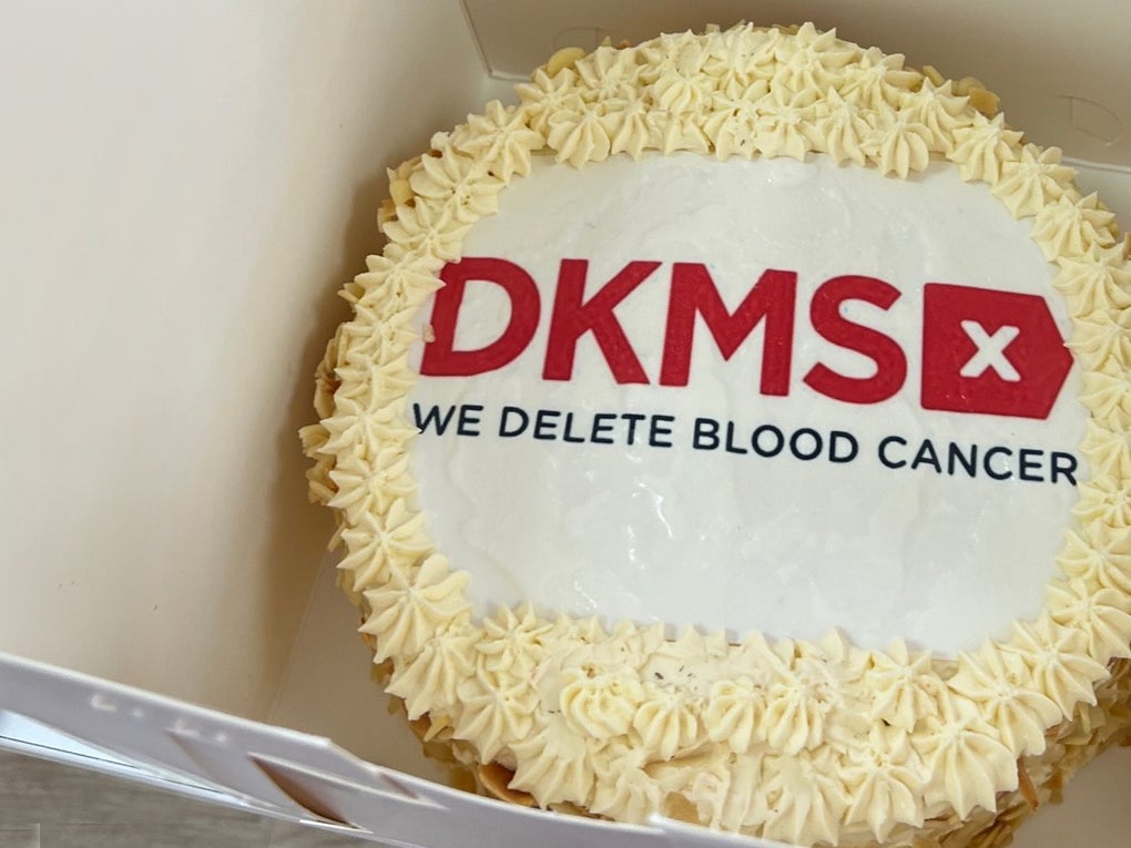 Celebration cake with DKMS logo on top Celebration cake with DKMS logo on top