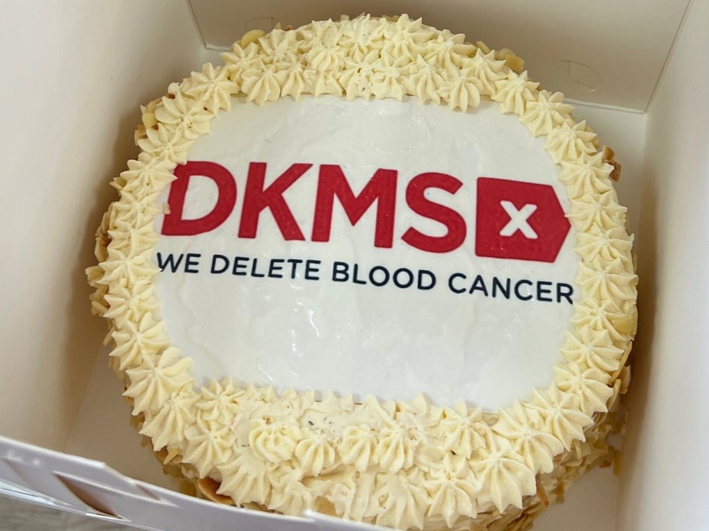 Celebration cake with DKMS logo on top Celebration cake with DKMS logo on top
