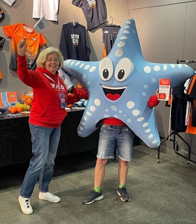 DKMS South West Hub Lead Lynda and a colleague in an starfish costume