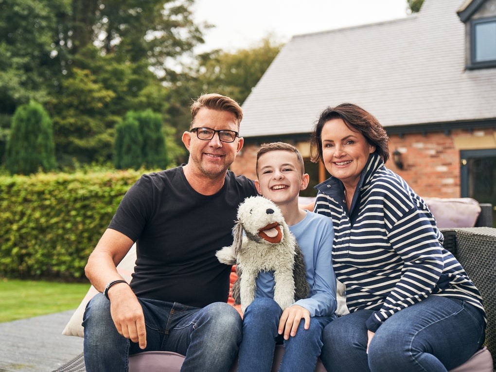 Finn with his parents, Paul and Jo, sitting in their garden Finn with his parents, Paul and Jo, sitting in their garden