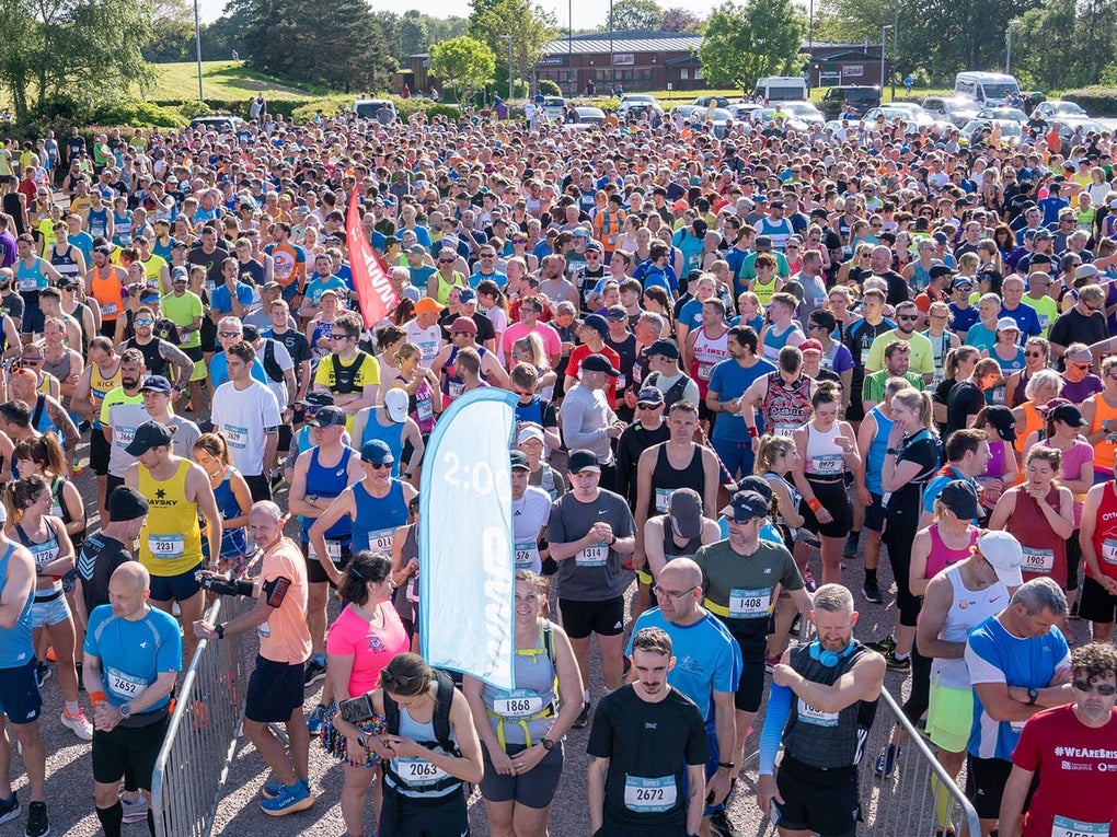 Group of runners waiting at a start line Group of runners waiting at a start line