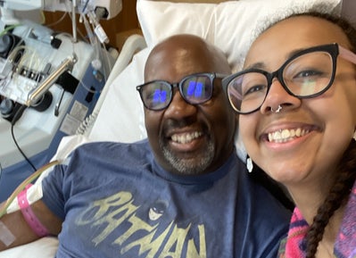 Paul smith and his daughters smiling at the camera in hospital Paul smith and his daughters smiling at the camera in hospital