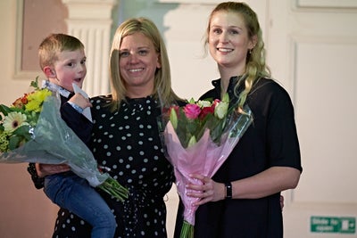 Alfie with his Mum and Christin holding flowers when they met for the first time Alfie with his Mum and Christin holding flowers when they met for the first time