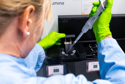 Image showing female scientist analysing laboratory specimens