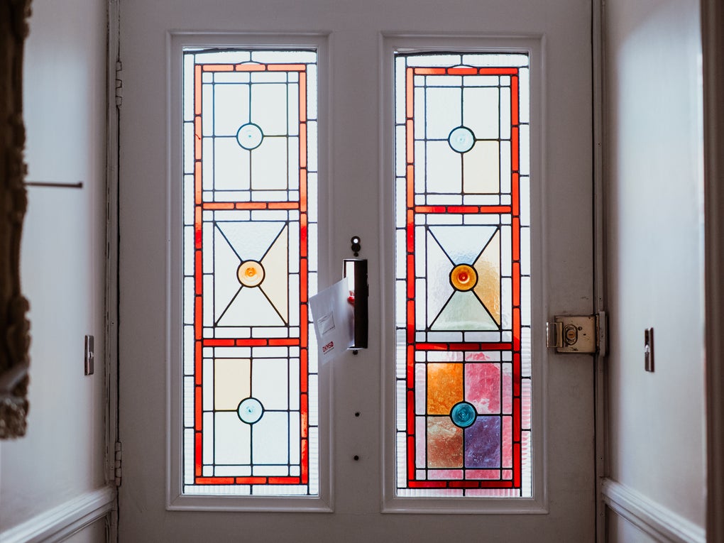 An envelope being posted into a letterbox An envelope being posted into a letterbox