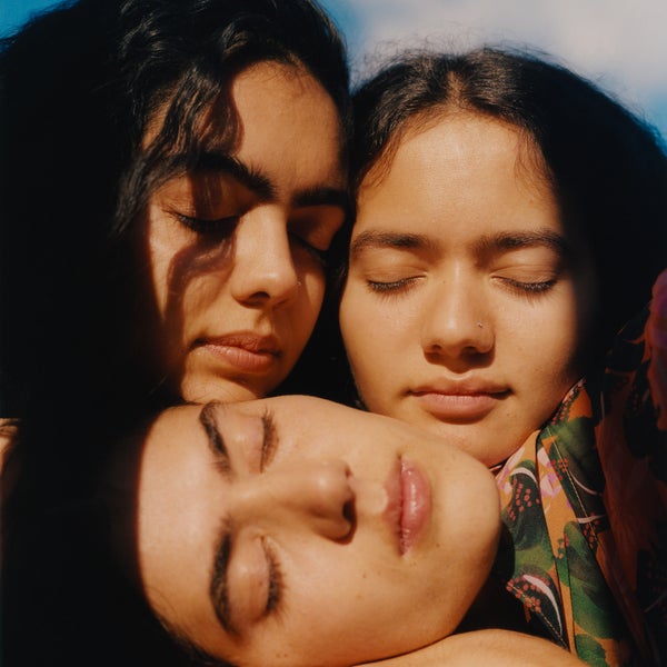 Image of three Asian female faces with their eyees closed Image of three Asian female faces with their eyees closed