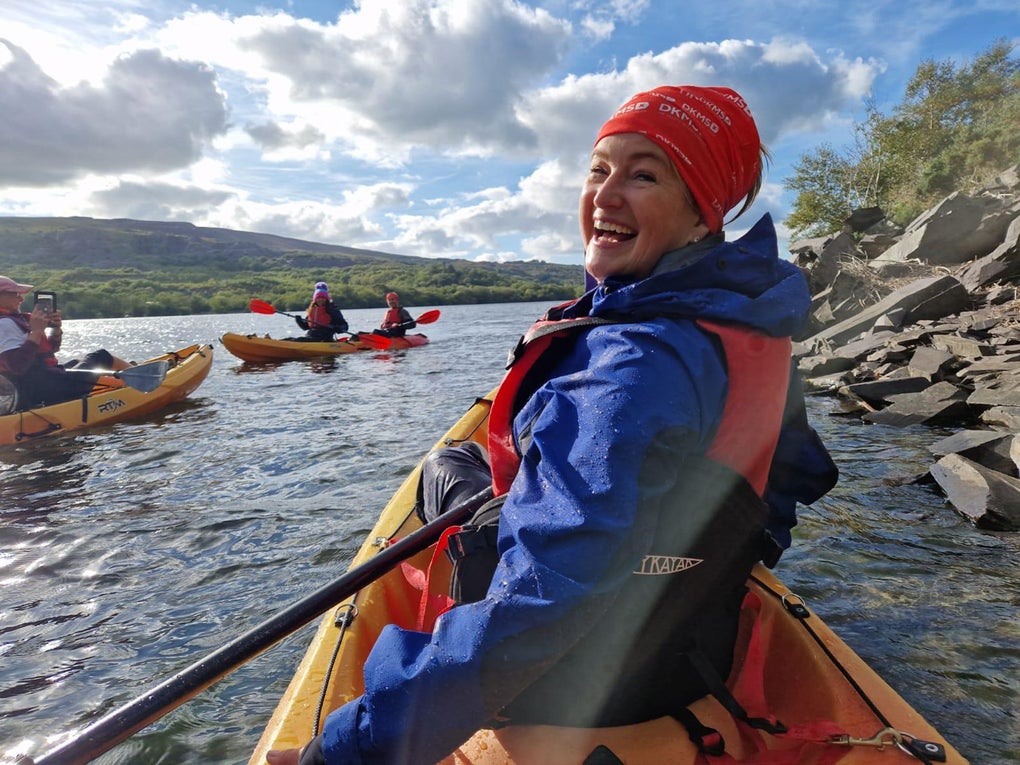 Claire Morgan-Hughees kayaking on a lake Claire Morgan-Hughees kayaking on a lake