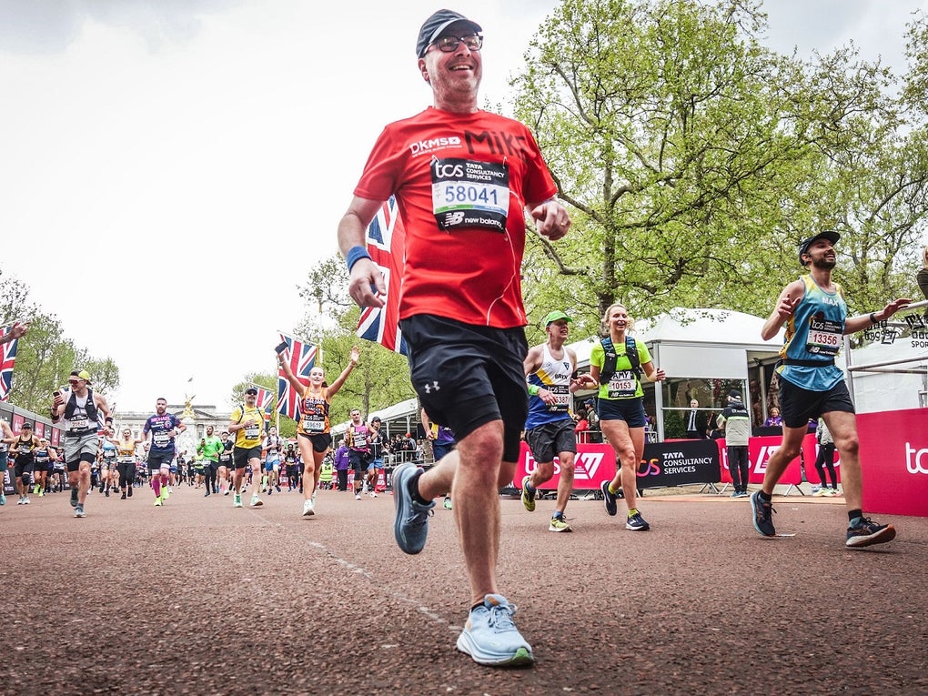 Man in DKMS t-shirt crossing the London Marathon finish line Man in DKMS t-shirt crossing the London Marathon finish line