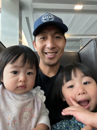 Ian Corpuz and his two daughters