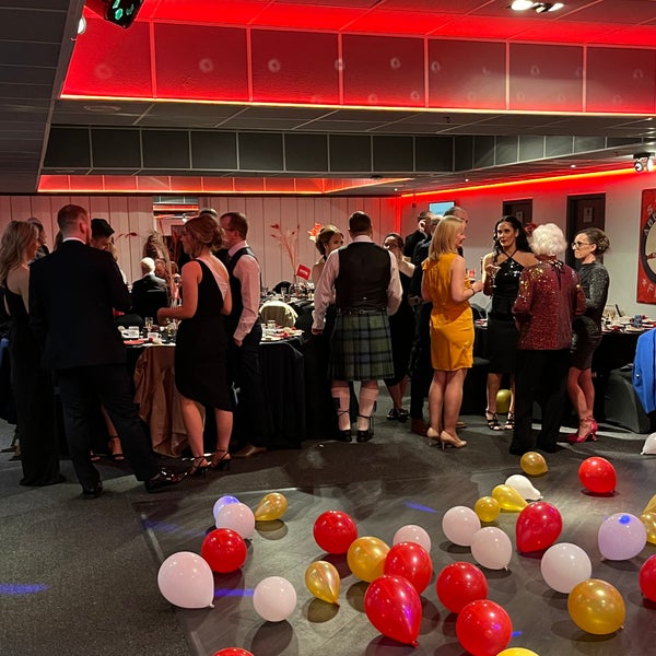 DKMS Scotland Gala celebrations in progress with many red yellow and white ballons in the foreground DKMS Scotland Gala celebrations in progress with many red yellow and white ballons in the foreground