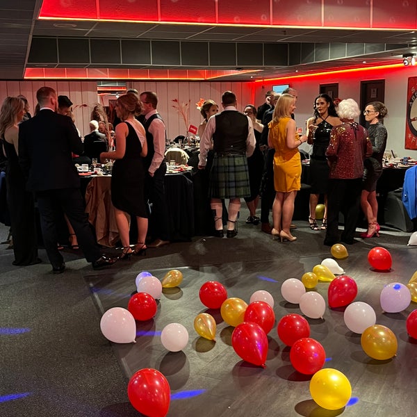 DKMS Scotland Gala celebrations in progress with many red yellow and white ballons in the foreground DKMS Scotland Gala celebrations in progress with many red yellow and white ballons in the foreground