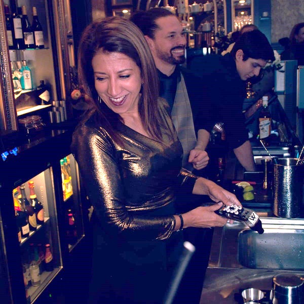 Poonam serving behind the bar at work Poonam serving behind the bar at work