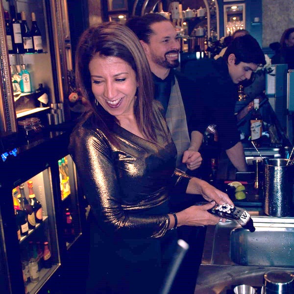 Poonam serving behind the bar at work Poonam serving behind the bar at work