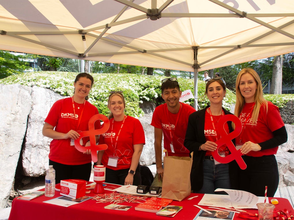Ian (centre) with four DKMS colleagues wearing red DKMS t-shirts at a donor drive in May 2023 Ian (centre) with four DKMS colleagues wearing red DKMS t-shirts at a donor drive in May 2023