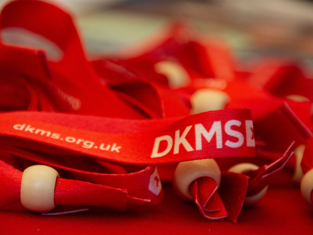 DKMS ribbon bracelets displaying website URL DKMS ribbon bracelets displaying website URL