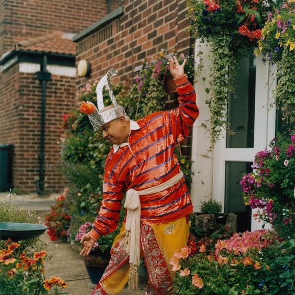 South Asian man wearing colourful clothes and a silver headdress South Asian man wearing colourful clothes and a silver headdress