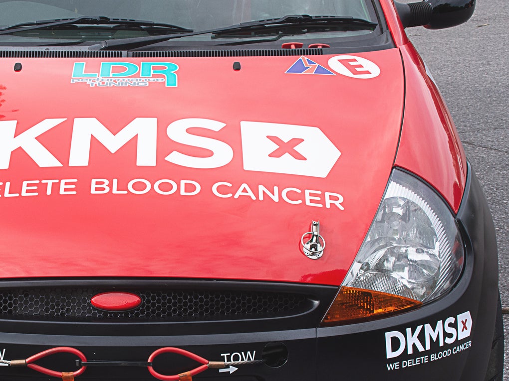 Bonnet of the DKMS car showing the DKMS 'We delete blood cancer' logo Bonnet of the DKMS car showing the DKMS 'We delete blood cancer' logo