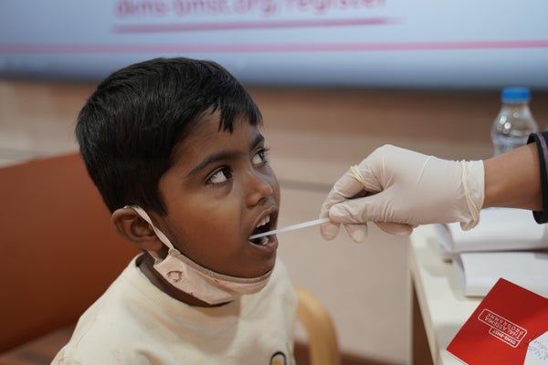 Indian boy being swabbed in his mouth at a thassalemia camp