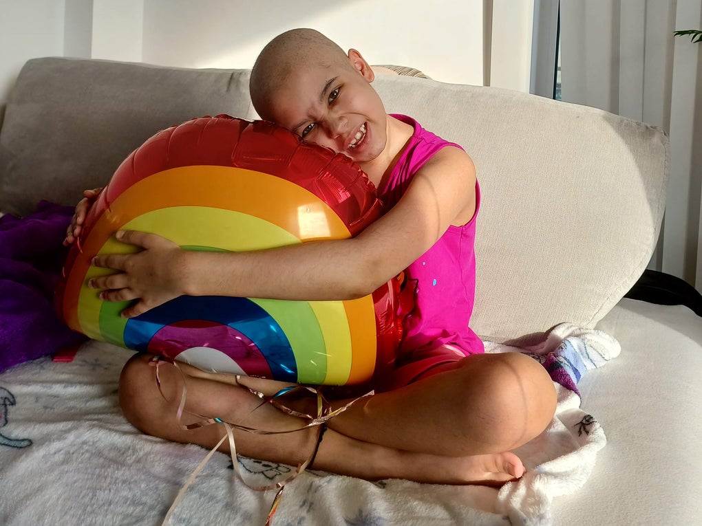 Aashna holding a rainbow balloon Aashna holding a rainbow balloon