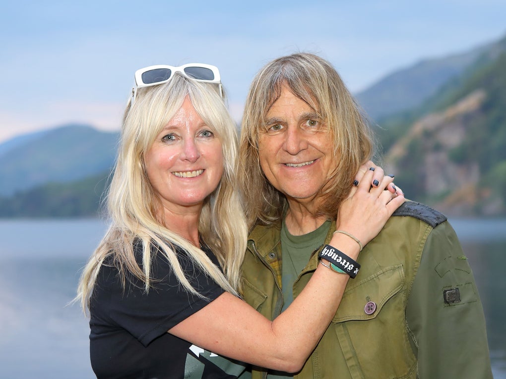A middle aged white woman and man in front of a lake A middle aged white woman and man in front of a lake