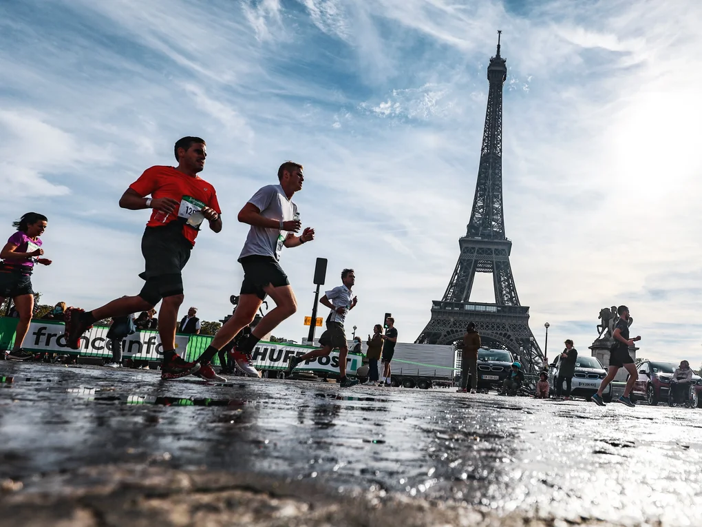 Several runners with the Eiffel Tower in the background Several runners with the Eiffel Tower in the background