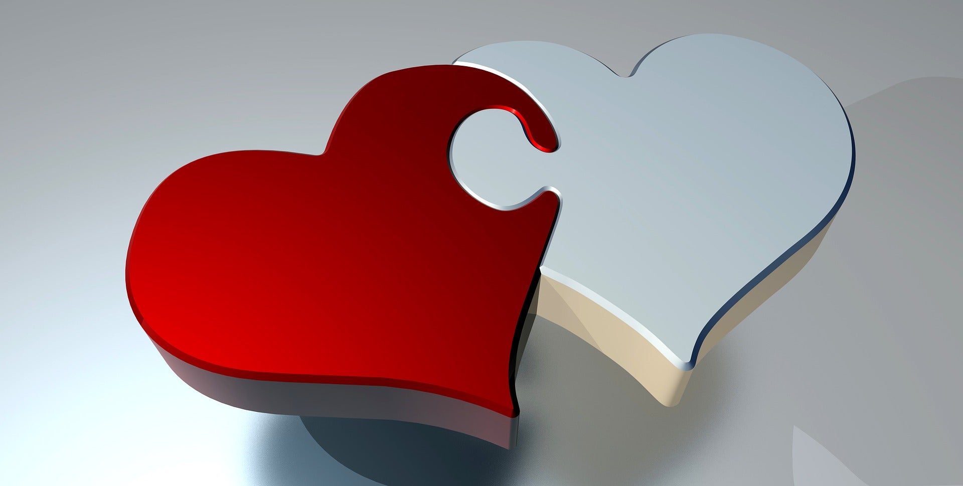 Interlocking red and white heart jigsaw pieces Image by PIRO from Pixabay 
