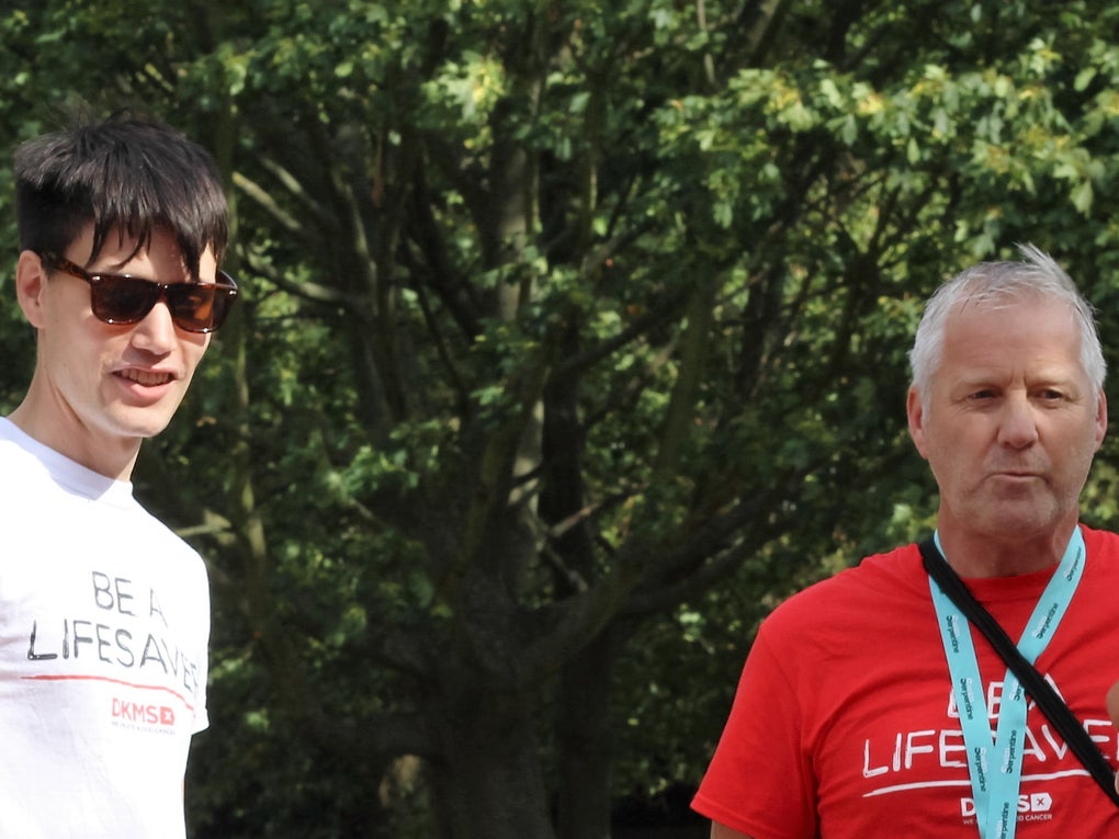 Four people wearing DKMS t-shirts chatting Four people wearing DKMS t-shirts chatting